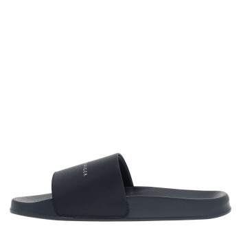 Claquettes slide bleu marine à semelle plate avec un logo embossé sur la semelle